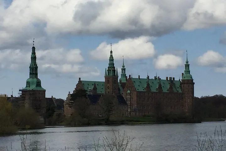 Frederiksborg Castle across the lake on a private Hamlet Castle and Frederiksborg tour